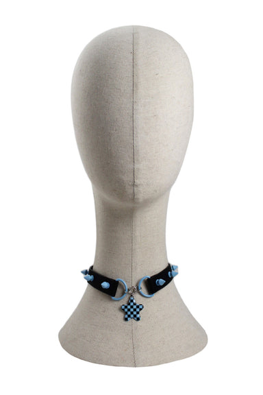 unlabeled faux black leather and baby blue star choker. features blue spike grommets, checker star charm, and adjustable lobster claw closure. 