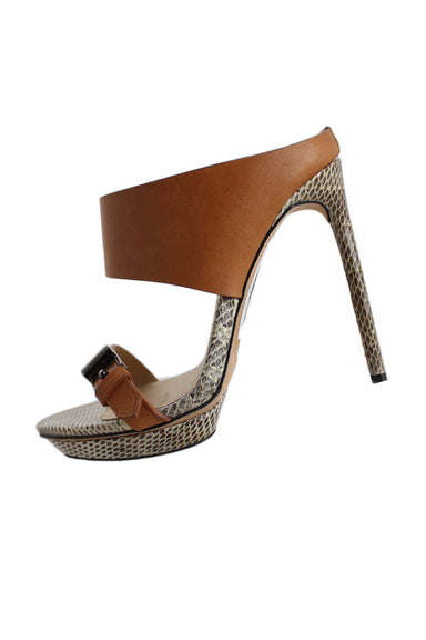 reed krakoff light brown/multicolor snakeskin and leather heeled sandal. features leather buckled foot strap + wide upper slide strap, ~0.5" platform, and spike heel.  