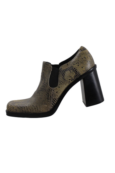 mia black and neutral toned heeled leather shoes. features glossy snakeskin-embossed upper, square toe, elastic side gussets, and stacked block heel. 