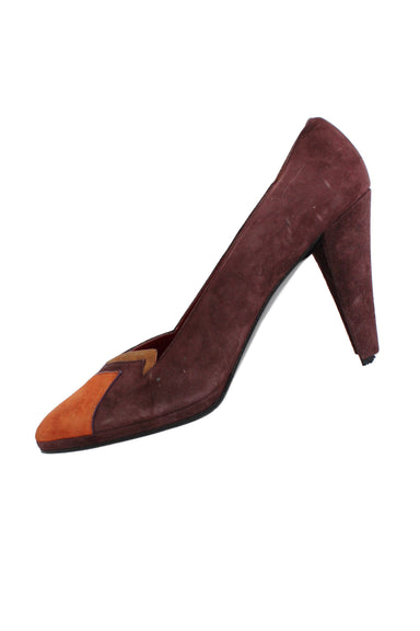  yves saint laurent burgundy leather pump. features color block pattern, pointed toe, cone heels, and slip on fit.