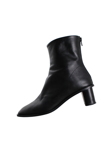 arket black heeled boots featuring a square toe, zip closure at the heel, tonal topstitching and a ~2" rounded heel. 