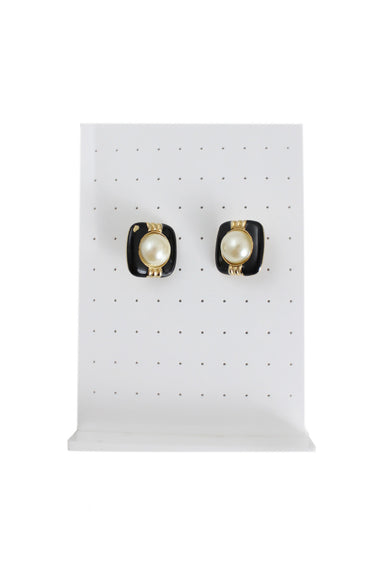 vintage gold and faux pearl clip-on earrings. features square shape, maxi pearl detail at center, and flip clip-on closure.