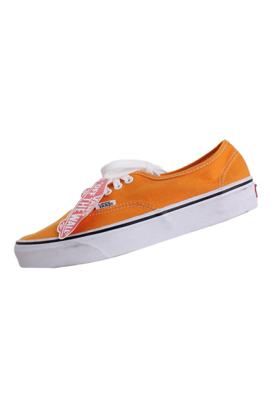 vans orange ‘authentic classic’ canvas shoes. features logo tab at sides/heels, top flat lace closure, and vulcanized waffle grip sole.