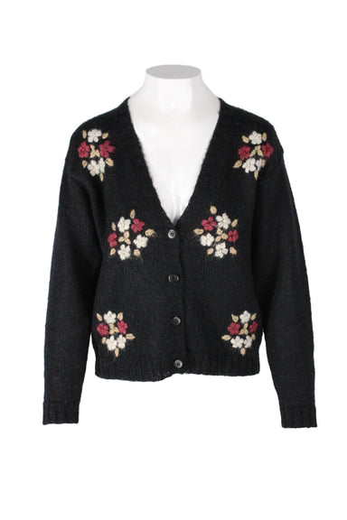 vintage black floral mohair-blend cardigan. features ribbed floral shell, padded shoulders, v-neckline, button closure along front.