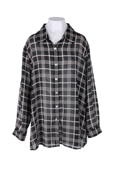 unlabeled black and white long sleeve button up shirt. features plaid print throughout, spread lapels, single button at cuffs, slit at sides, and pearl shell button closure.