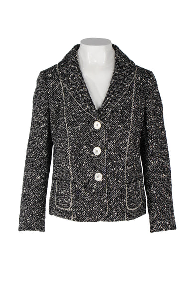 rena lange black and white wool blend blazer. features tweed design, contrast stitching, notched lapels, patch pockets at waist, buttons at cuffs, and embossed brand logo at pearl maxi button closure.