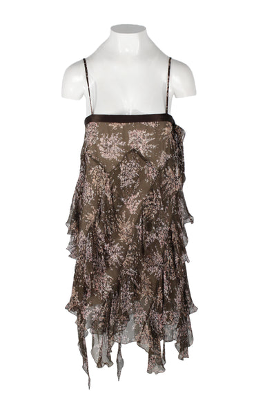la perla brown silk mini dress. features sheer shell with abstract print of small pink flowers, diagonal ruffles all over body, asymmetrical hem, straight neckline with drawstring tie at left, thin straps, fully lined in crepe, and hidden zipper at left side. 