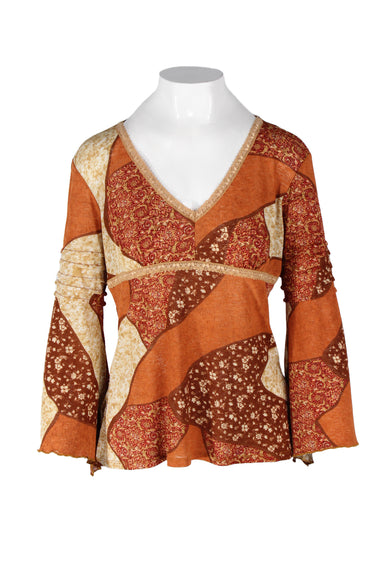 vintage y2k forenza burnt orange-toned floral blouse. features multi-floral block print shell, v-neckline with lace trim, empire waist, relaxed fit, wavy trim. 
