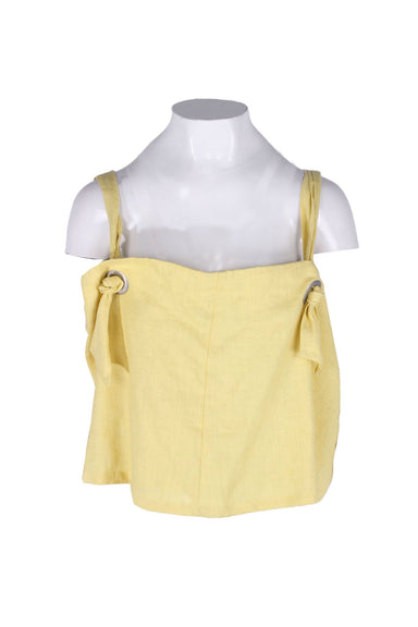  back beat co. light yellow strap top featuring a square neckline, adjustable tie straps, silver tone ring hardware, tonal topstitching and a cropped fit.