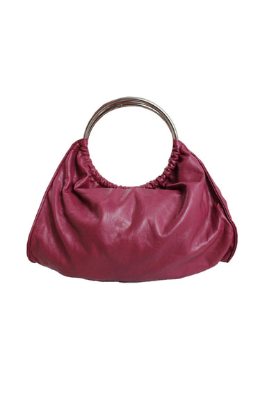 description: vintage giannini faux leather burgundy handbag. features silver-tone metal ring handle, pressure fastener closure, and interior zip closure pocket. 