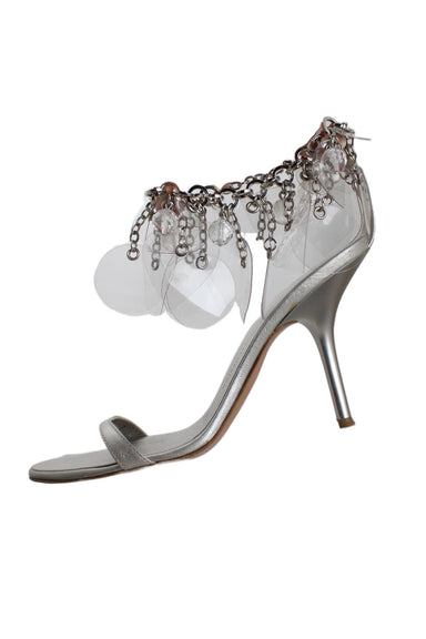 giuseppe zanotti silver heeled sandals with tassel chain ankle strap. genuine leather upper, insole, and sole. decorative chain ankle strap, featuring clear beads and cut-out plastic shapes.  hook closure at a