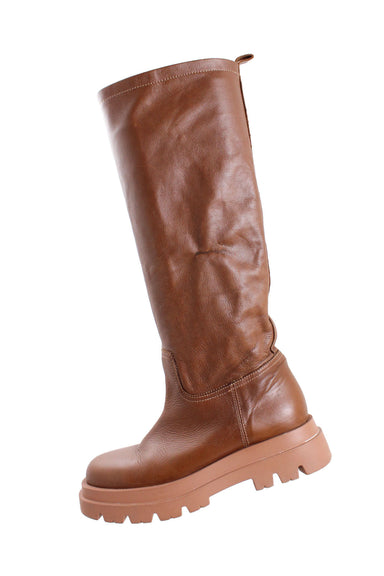 lemaré brown chunky sole knee-high leather boots. brown leather upper. chunky 1" soles. no closure, pull-on style. sold in "as is" condition for signs of wear at heels/soles and for signs of wear at side of left boot shaft (see photos).